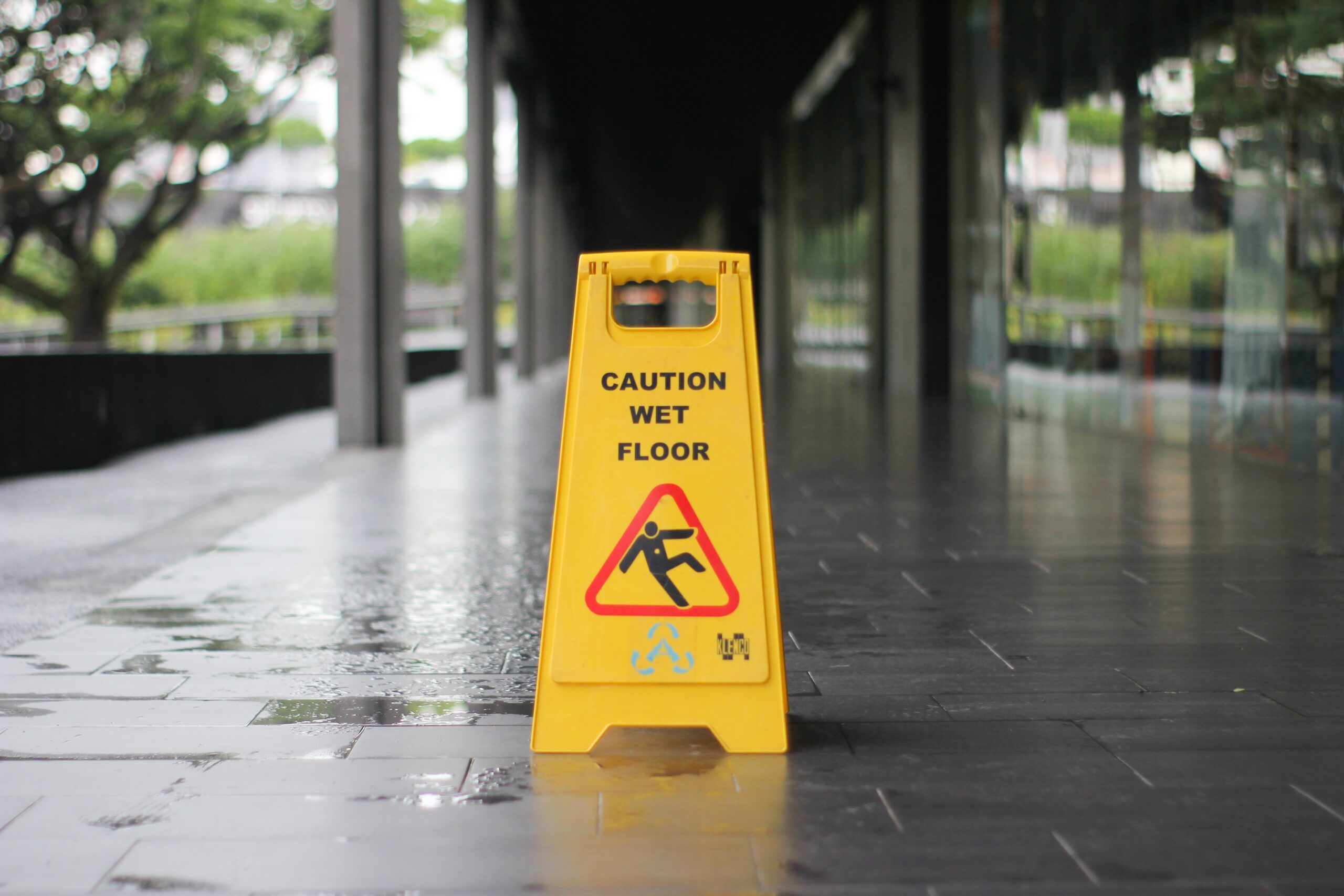 caution wet floor sign on train platform